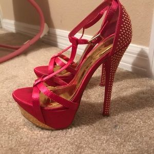 Bright pink and gold platform heels.